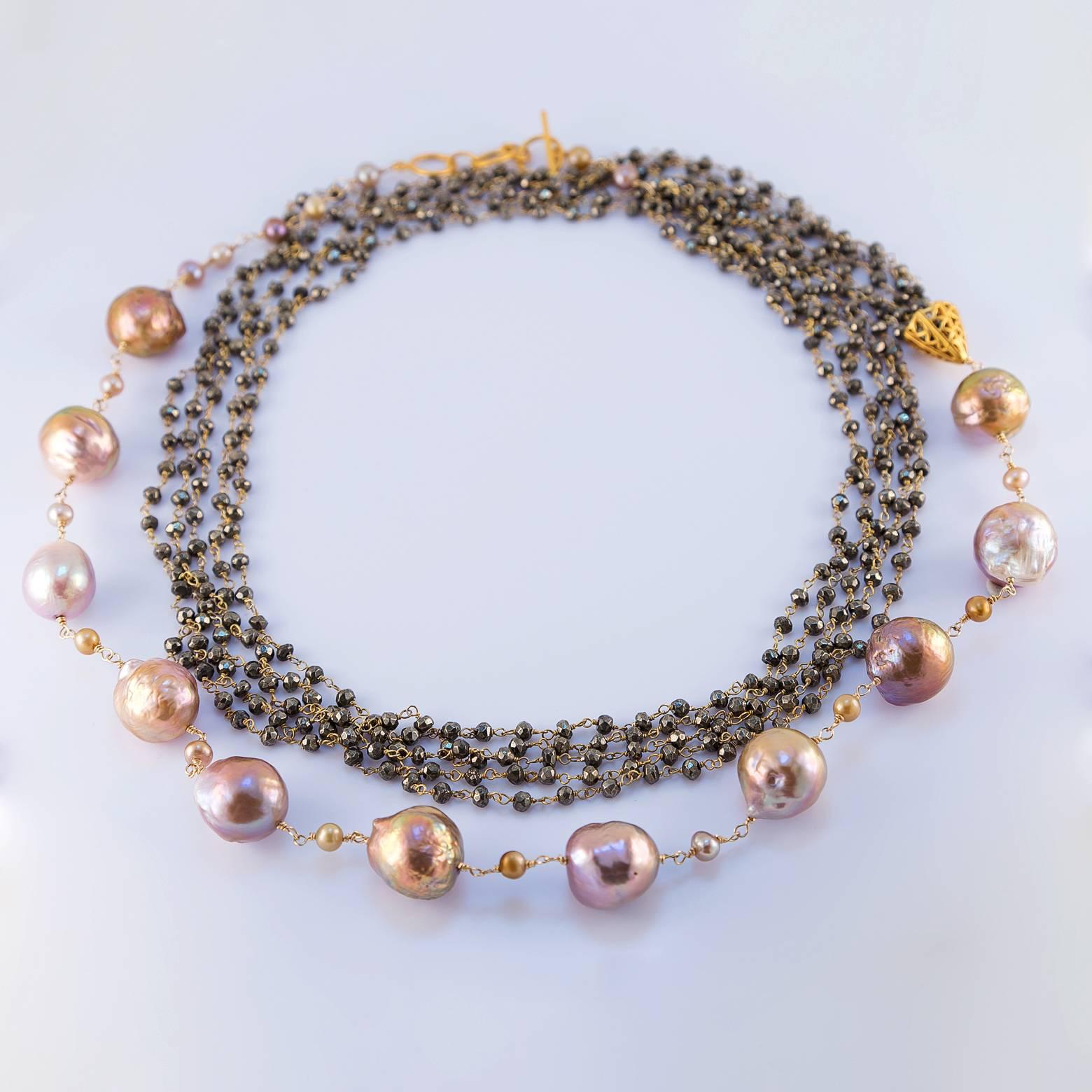 Fresh Water Pearls and Hematite Beads! This yellow gold plated matinee length necklace comes with 5 strands of hematite beads and 16 large fresh water pearls. The 40.5 inch length allows so many different ways to wear this gorgeous necklace. It's