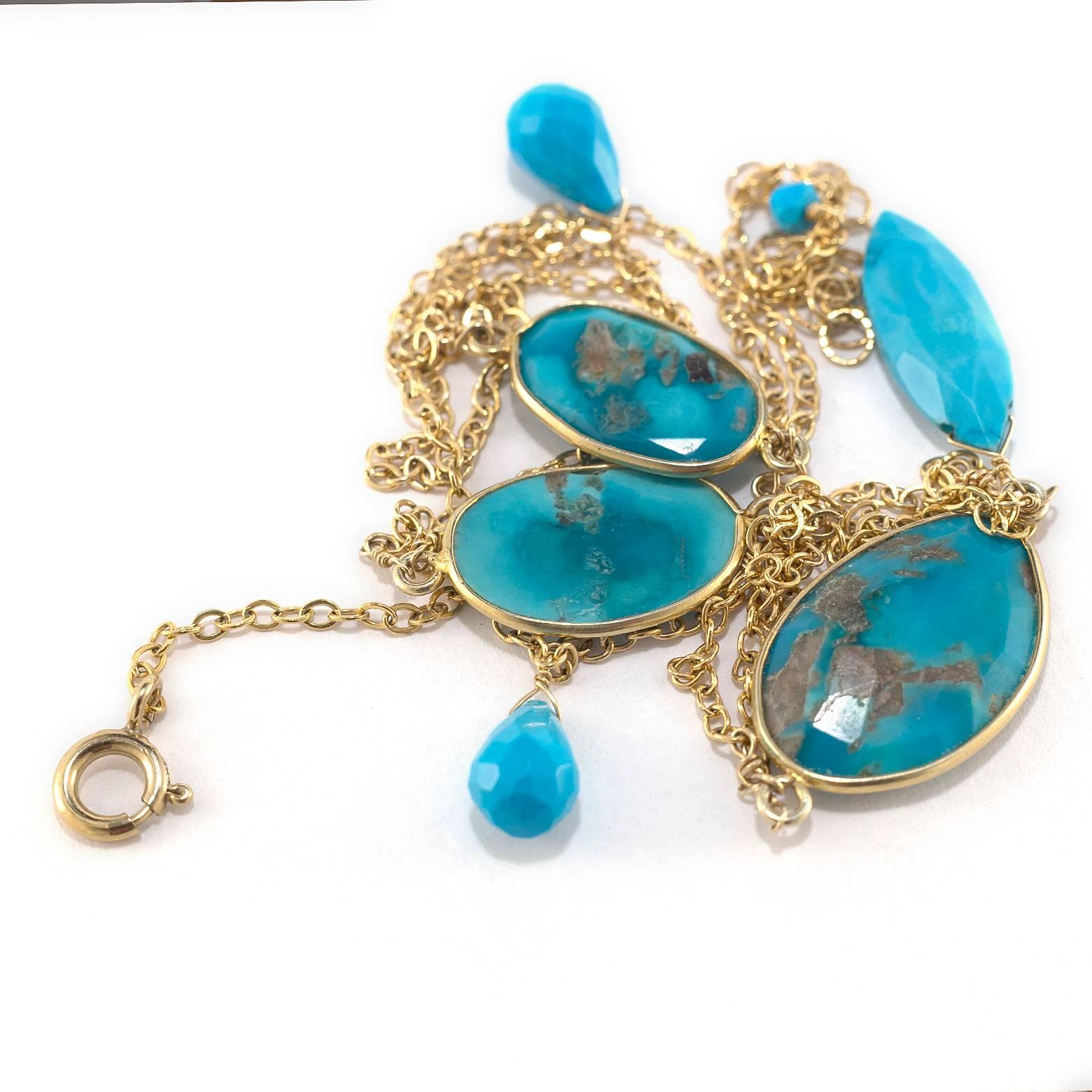 This is a delicate 'Sleeping Beauty' Turquoise necklace. The cascades of chain attach effortlessly to the gold rimmed turquoise.The drops finish it off to create a stunning piece of art that explodes with color!