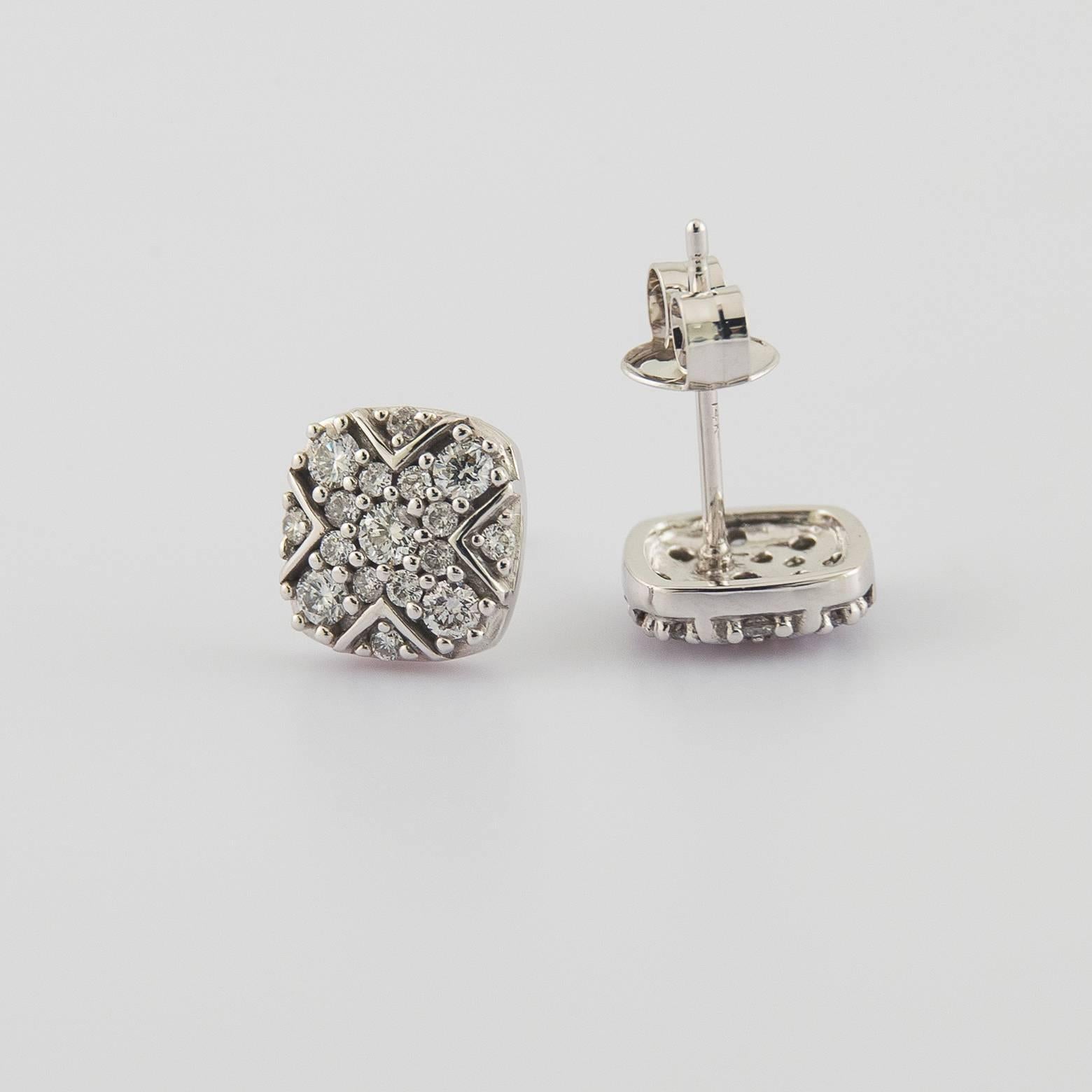17 Diamonds on each stud earring. They look antique, intricate, and stunning. The detail work is incredible and each piece feels like a piece of history even though they are contemporary. The elegance has a professional aspect to them and they can
