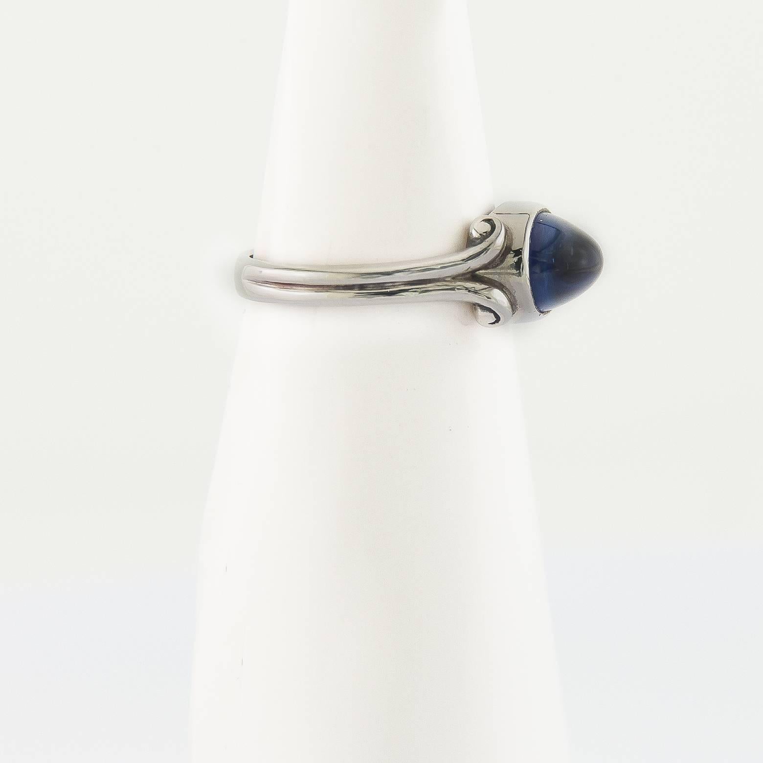 4 carats of paradise ocean blue sapphire against a platinum band accented with perfect swirls. This contemporary and classic ring has a hint of roman and grecian design,. Size 6.5 this ring can be sized up or down, Platinum is a pure precious metal.