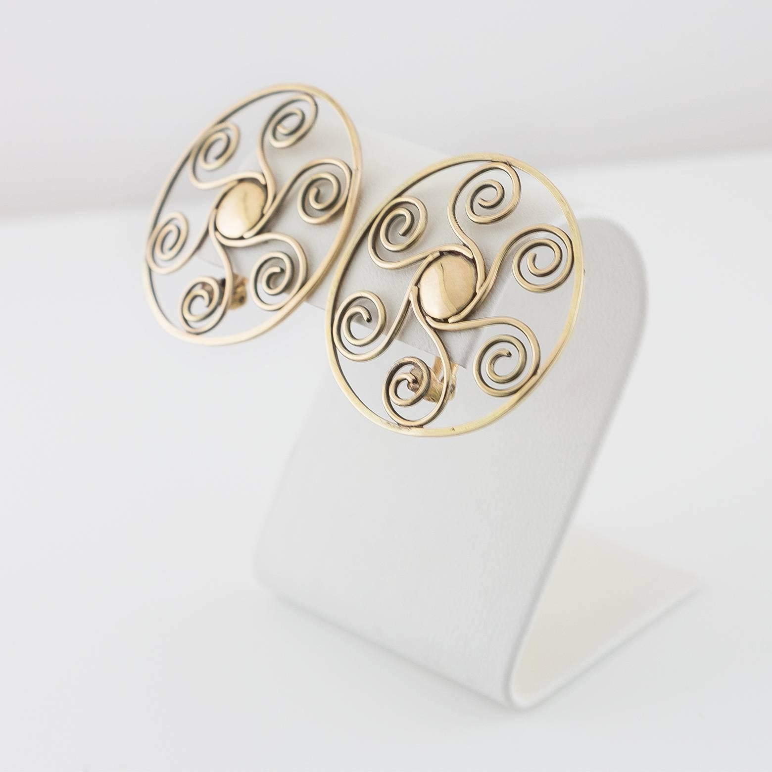 These lightweight, fun and artsy clip-on 14k earrings are elegant and regal. Easily worn casually or dressed up for added class, they are comfortable and add flare to any outfit.  Spirals, intricate and detailed with a little style and fun- these