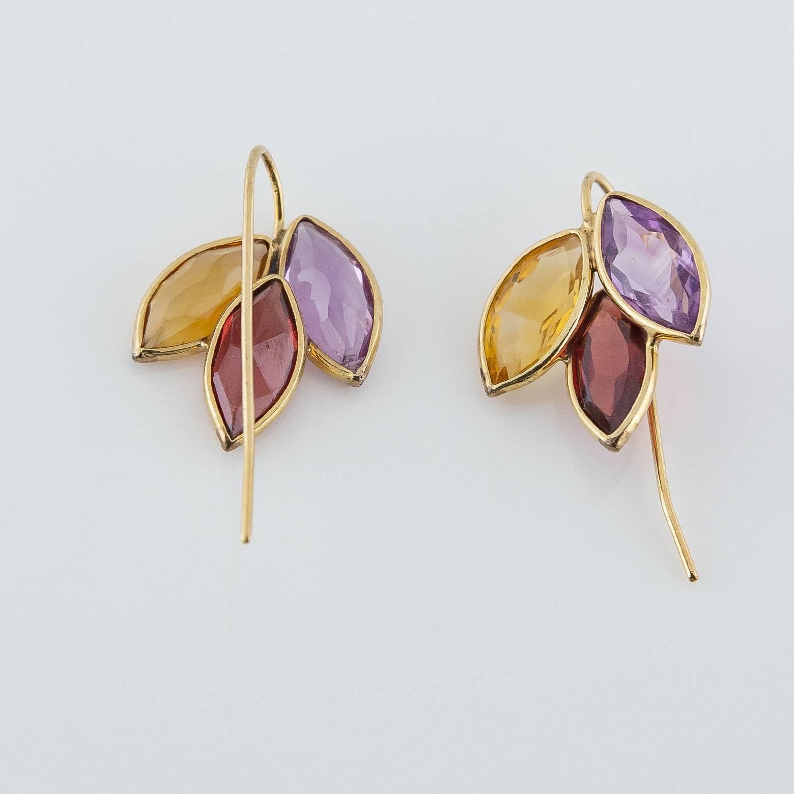 These beautiful drop earrings are full of fall colors with a dash of purple that bring excitement- like adding a wonderful glass of wine to ease the day. These delicate and sophisticated earrings can be worn with almost anything and to almost any