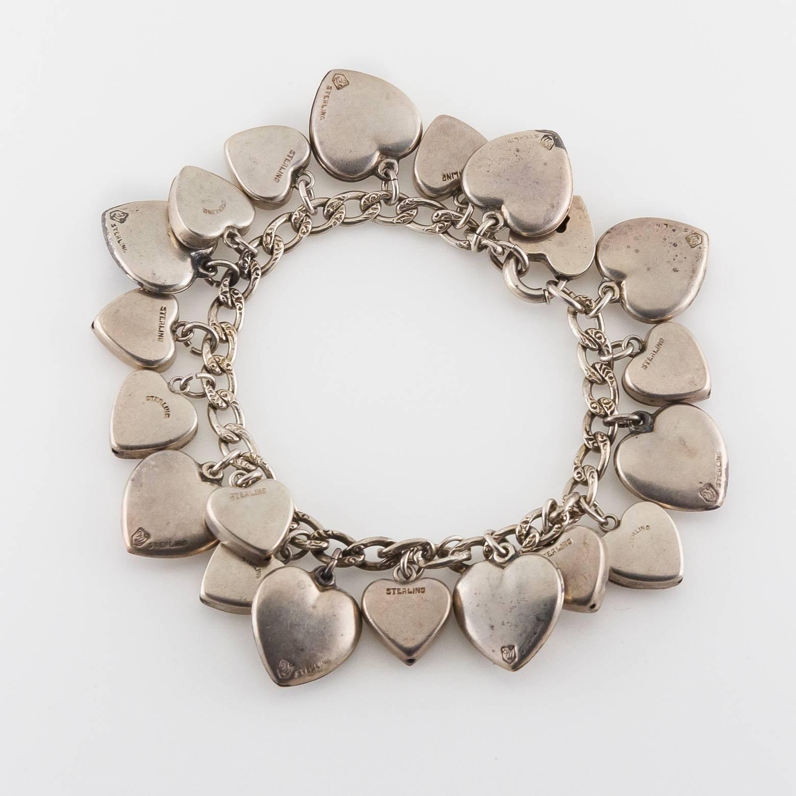 This beautiful antique charm bracelet is dazzled with clovers, flowers, bows, hearts and keyholes. Made out of sterling silver in America the pieces themselves were most likely made in the 1880's but assembled into a bracelet in the 1920's. It's