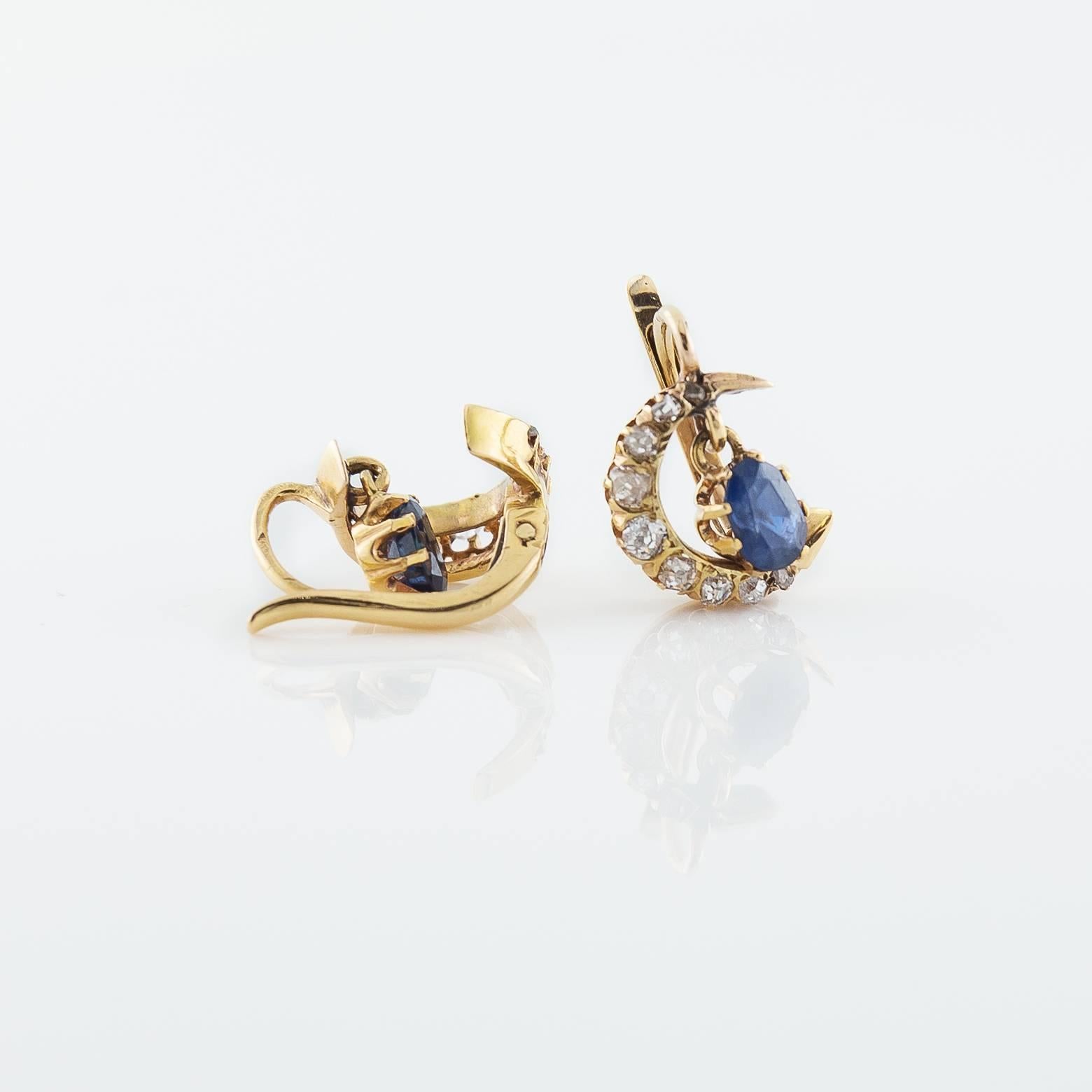 These gorgeous drop earring sparkle with diamond crescent moons and  teardrop sapphires ( 0.70 ct)  set in 18k gold. These are unique and wonderful and you will receive many compliments whenever you wear them.