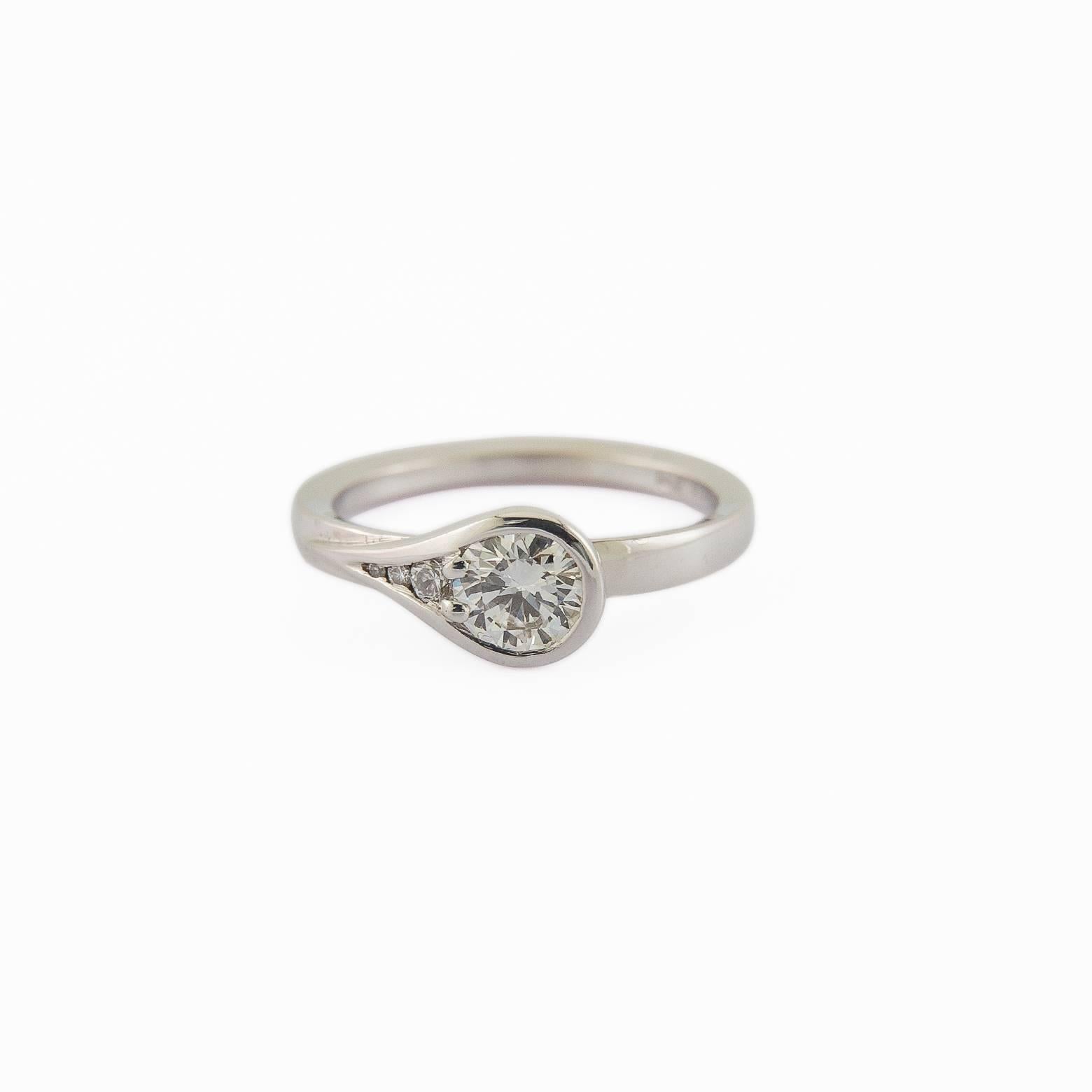 This stunning diamond ring adds up 0.61 carats and is set in 14K white gold. The style is clean and chic creating a modern tear drop shape with 4 diamonds in total. The clarity and color of the diamonds are VS2, white and bright. Comfortable and