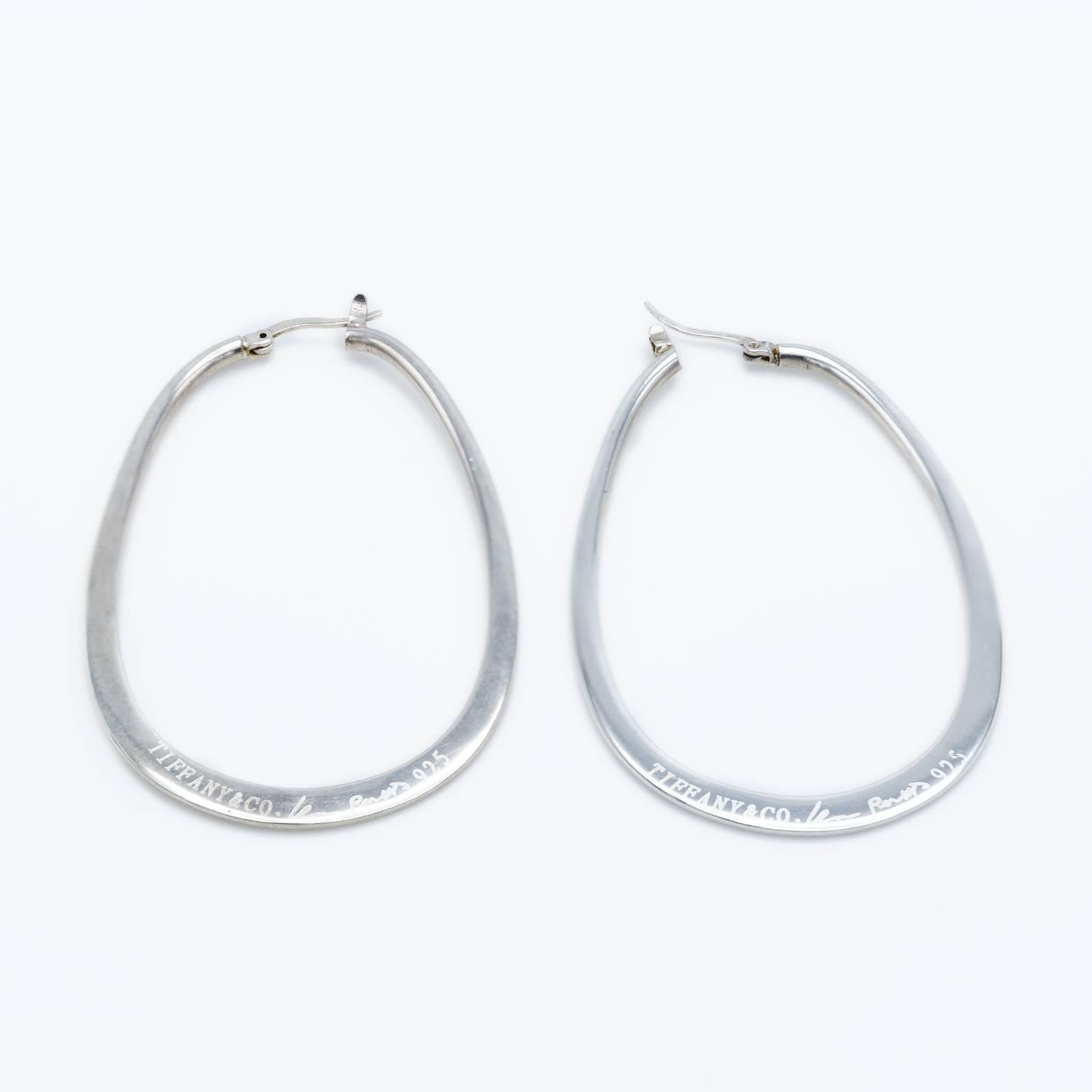 Retro Large Sterling Silver Hoops reminiscent of the 1990's. These are big and fun hoop earrings brightly polished and with the classic Tiffany and Co. engraving on the side. A must have to wear casually or even dress them up for a night on the