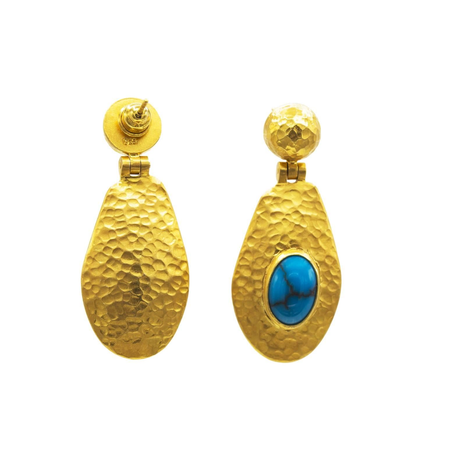 These unique Egyptian Turquoise earrings are rich in the deep color of turquoise that is luscious and royal. These earrings have movement and shine with the hammered texture and hinge attachment. They are lightweight and elegant. The vermeil is very