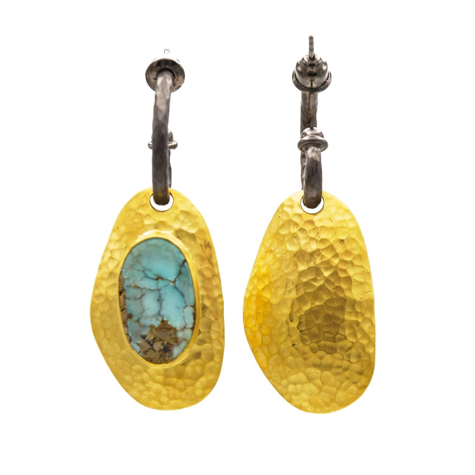 These pieces of Persian Turquoise are intricate with the varying shades of light blue and teal it looks as if you're staring at islands in paradise. Complimented by the hammered extra thick gold vermeil and oxidized sterling silver these earrings