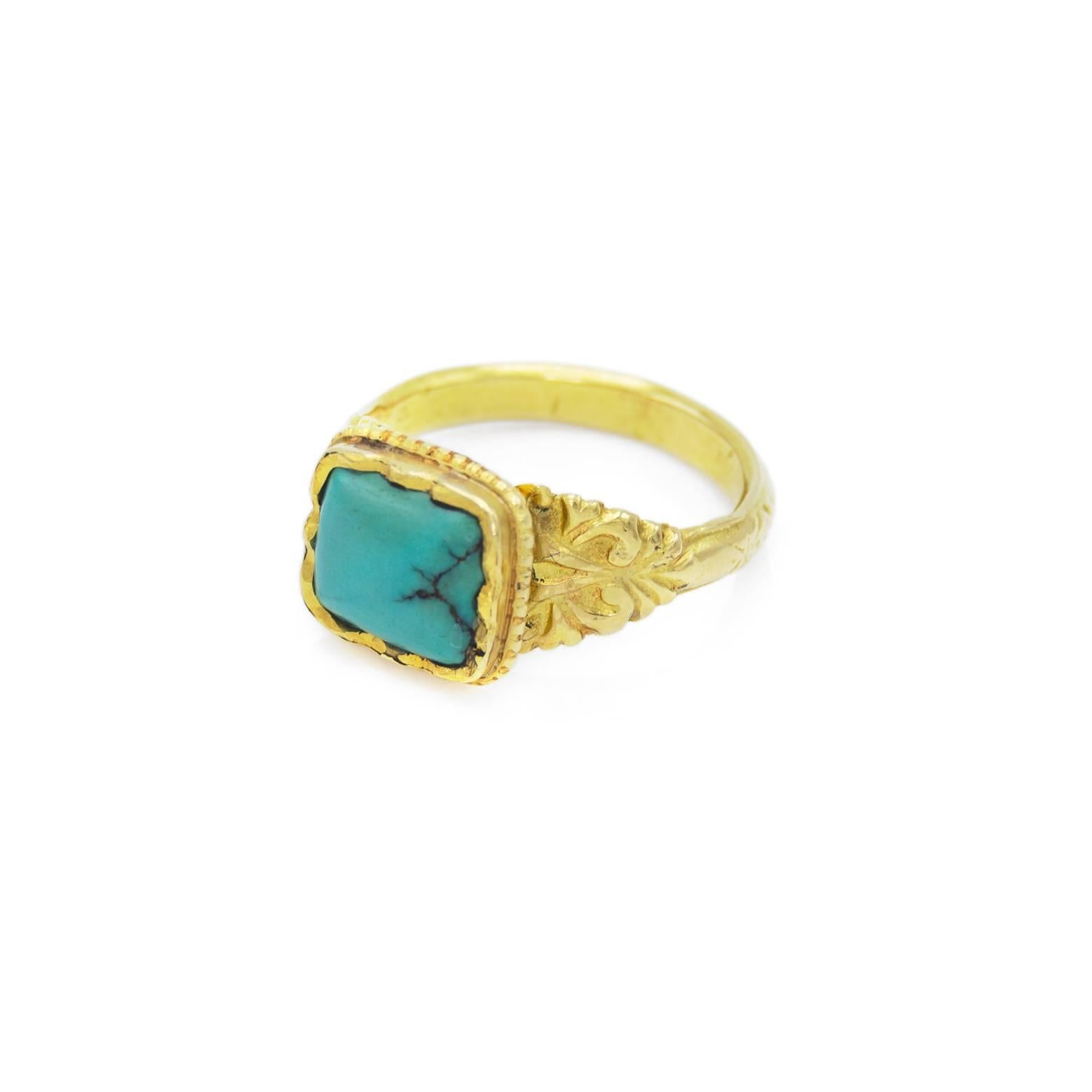 Turquoise and gold are a luxurious combination and this ring speaks luxury but is understated. The green blue hue of the turquoise speaks of ancient camel treks across the Sahara......Size 7 3/4. Perfect for a stylish gentlemen or sophisticated