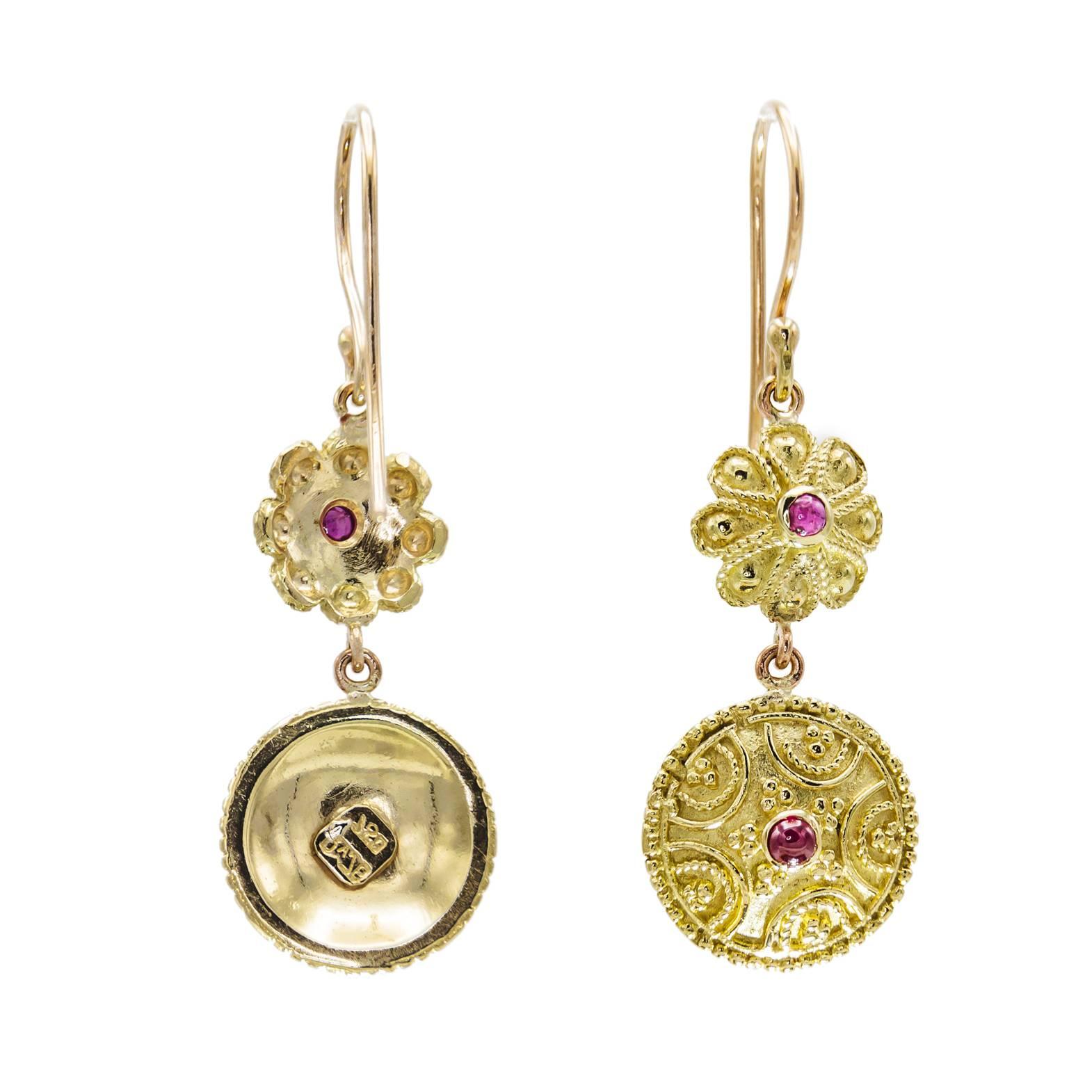 These beautifully engraved two part Ruby earrings are fun and fancy. The engraving is byzantine inspired elegant and feminine. The perfect gift for a special woman or for yourself.:))