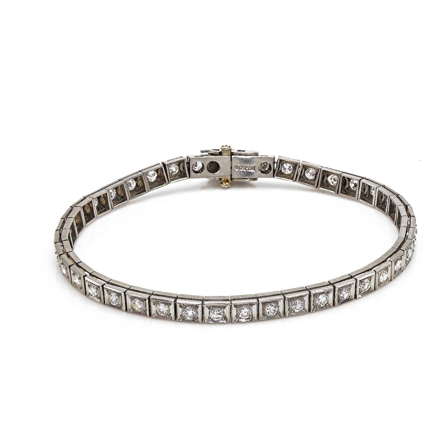 This  stunning Platinum tennis bracelet from the Mid century has dazzling diamonds beautifully set in an Art Deco motif. You can wear this gorgeous bracelet everyday and everywhere as it has a very secure safety lock. The 2.4 carats tw diamonds old