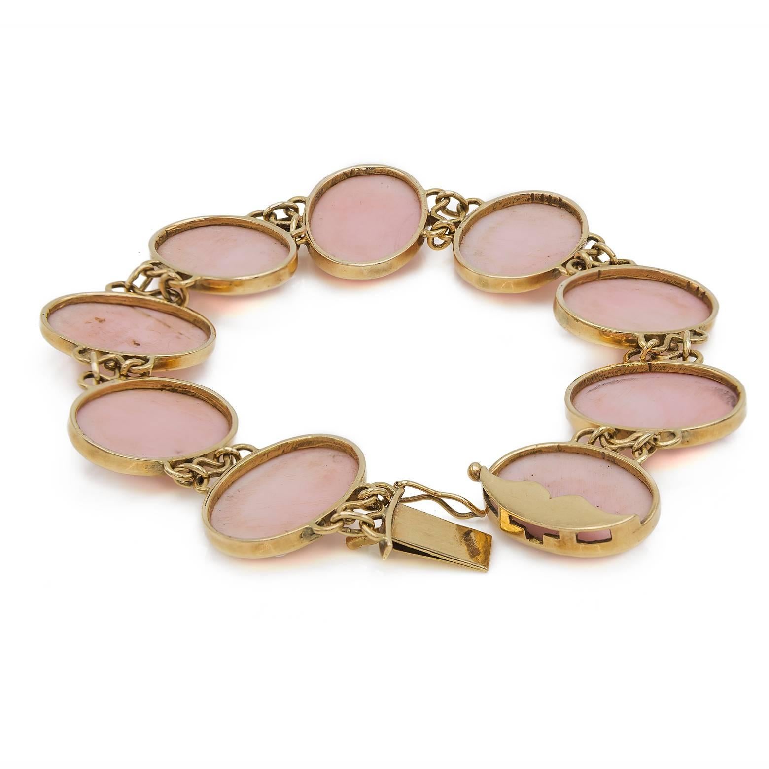 Many different flowers are engraved in this beautiful light pink conch shell reminiscent of the classic 1930's in an Art Nouveau Style. The detail work on this bracelet is gorgeous and the petals, leaves, and stems are precise and delicate. 