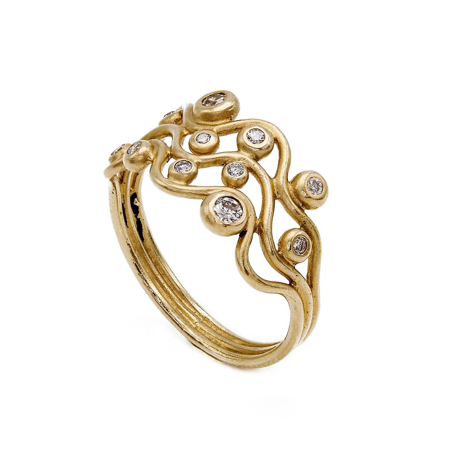 Swimming in the California sun on Golden waves! Made in our San Francisco Bay Area Studio this 14K yellow gold ring is adorned with 11 diamonds and dances as the swirls entertain your wild imagination. One of a kind and a size 7.  The size can be