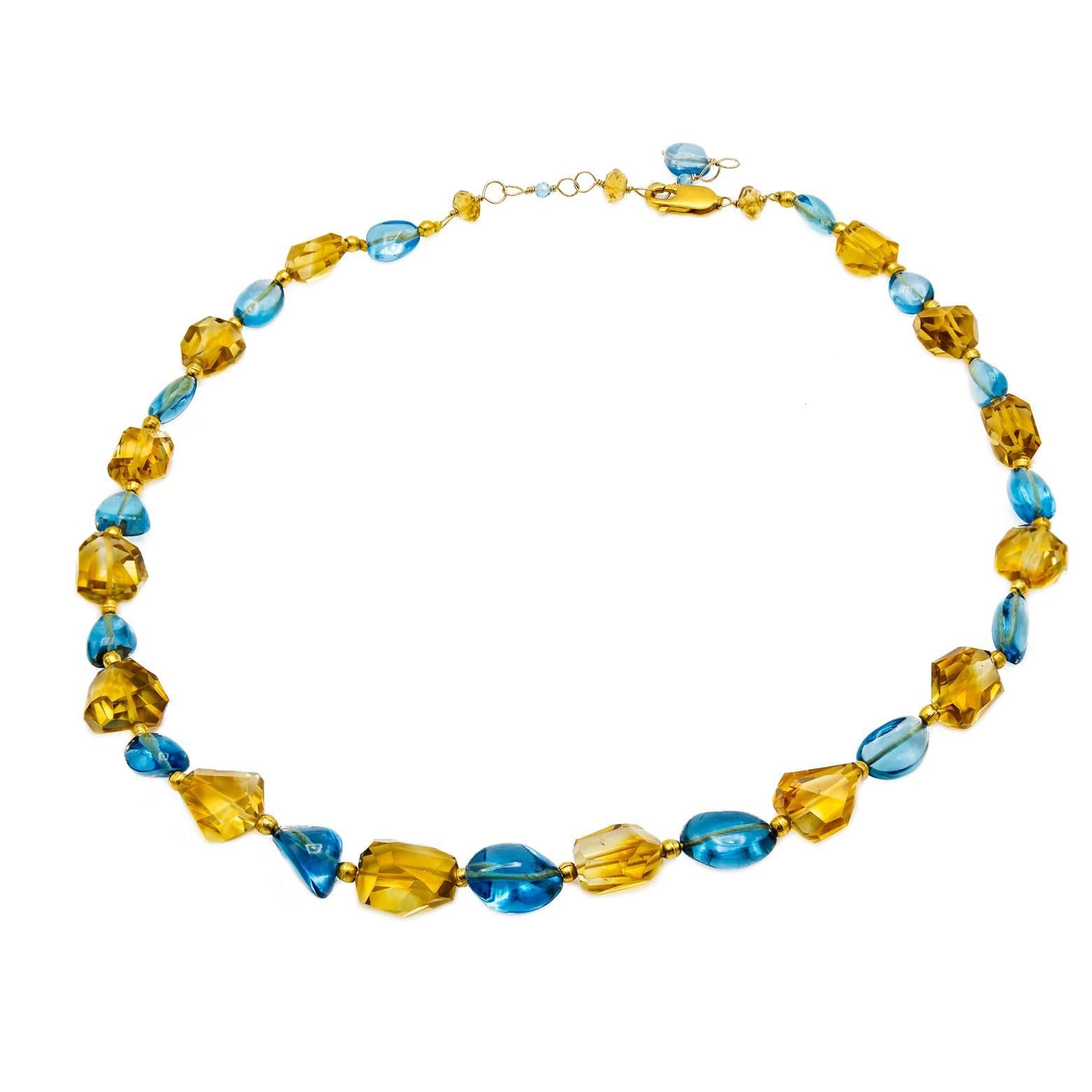 Alternating colors of blue topaz and citrine create a beautiful Caribbean Sea vacation palate sure to transport you to paradise. With facets on every unique bead separated by gold beads this elegant necklace is sure to dazzle your wild imagination. 