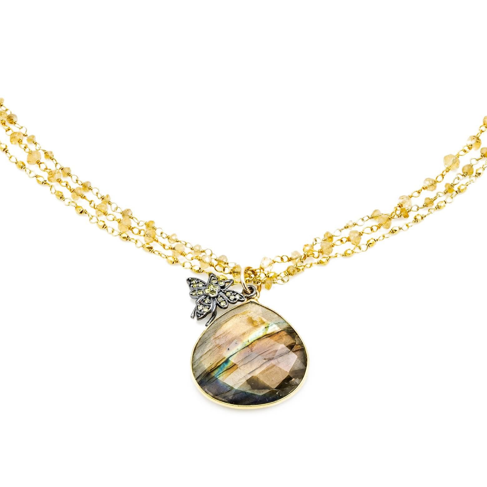 This stunning necklace is made of three gorgeous strands of citrine beaded gold chains, one large faceted labradorite pendant, and an oxidized sterling silver bumble bee adorned with diamonds. This piece was handmade in our San Francisco Bay Area