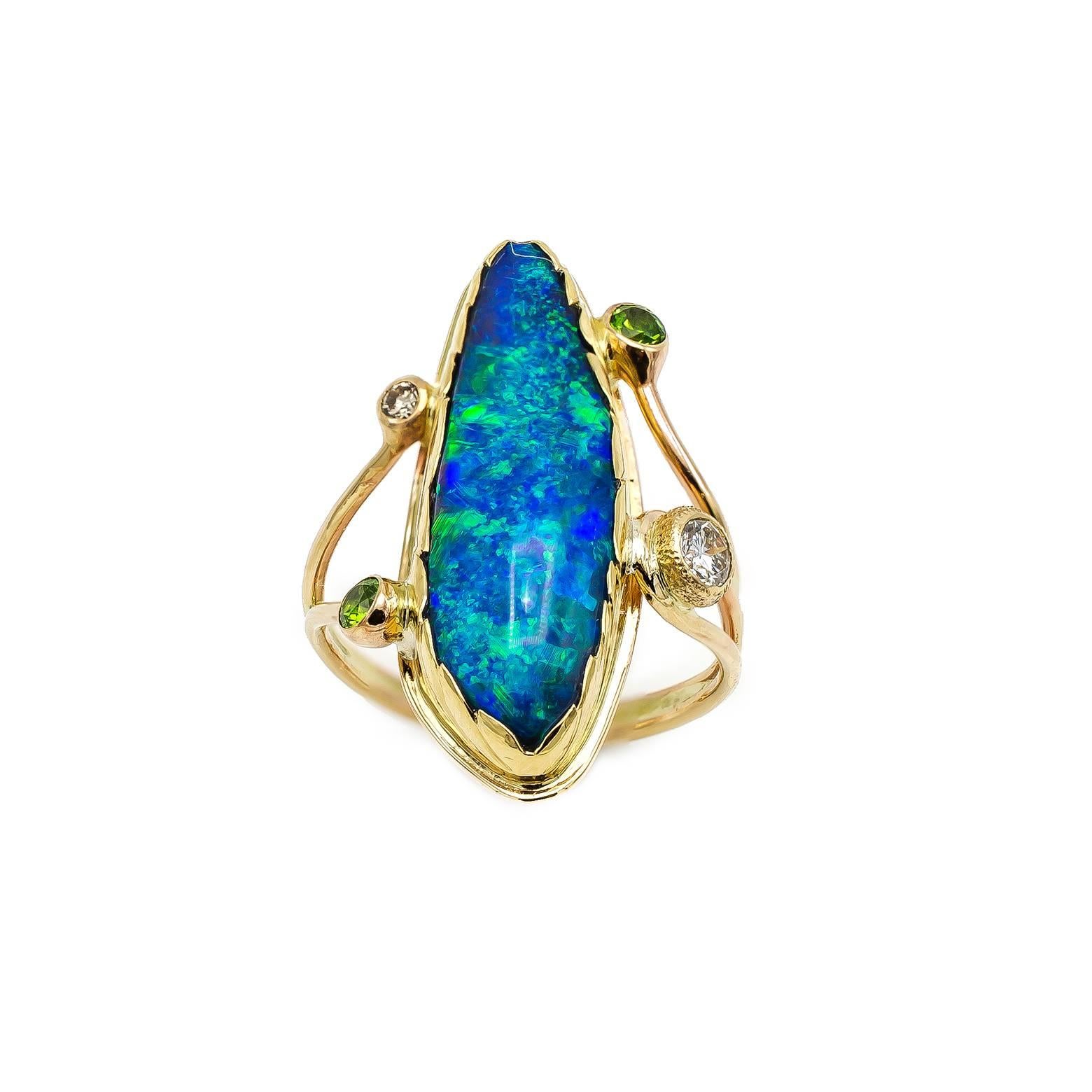 Large Boulder Opal Ring with Green Garnets and White Sapphires Set in Gold In Excellent Condition In Berkeley, CA