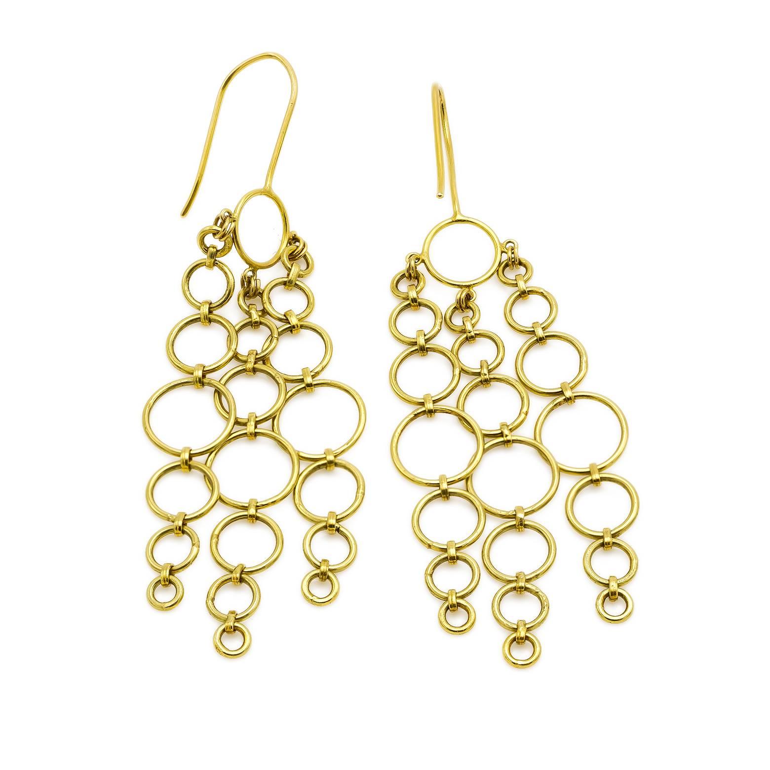 18K yellow gold chandelier circle earrings. Fun and chic and perfect for a night on the town. These beautiful chains made up of varying sizes of circles swing and sway and dance with a fun celebratory attitude. Easily dressed up while adding a touch
