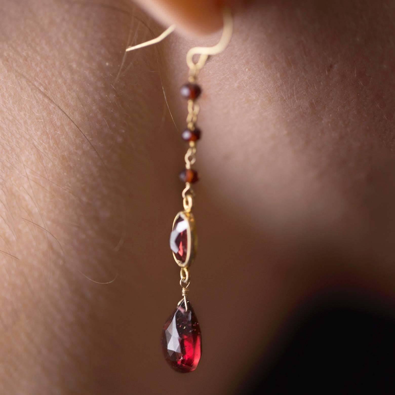 Women's Faceted Garnet and Gold Dangling Earrings in a Tapered Design