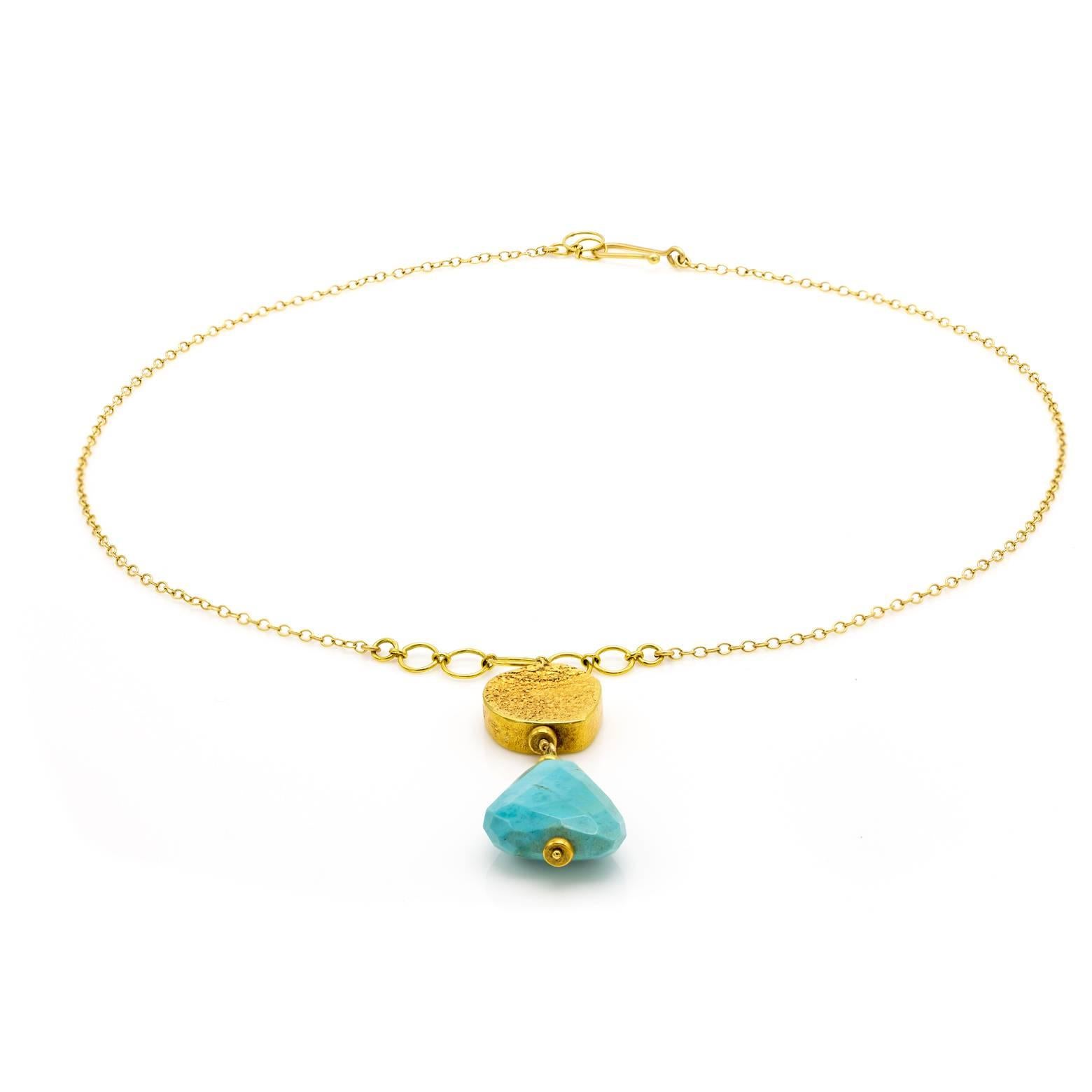 A gorgeous and artistic 18K yellow gold necklace with a substantial faceted turquoise piece. Elegant and easy to dress up or down this necklace sings songs of the Mediterranean Sea and Caribbean Skies. Beautiful textures and a one of a kind
