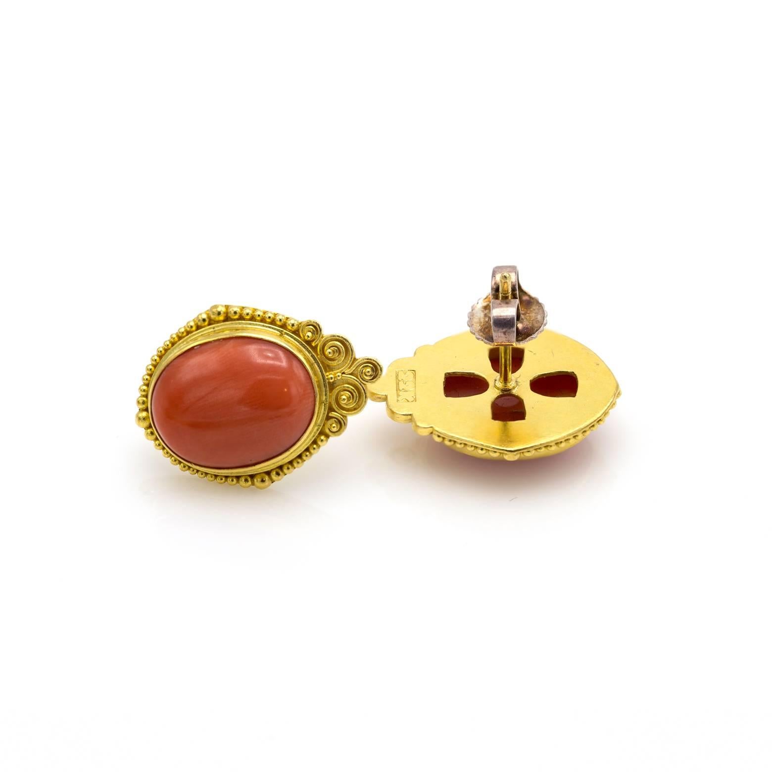 The warm glow of natural coral is beautifully set in beaded 22k gold. These stud earrings are elegant and timeless. A rare find!