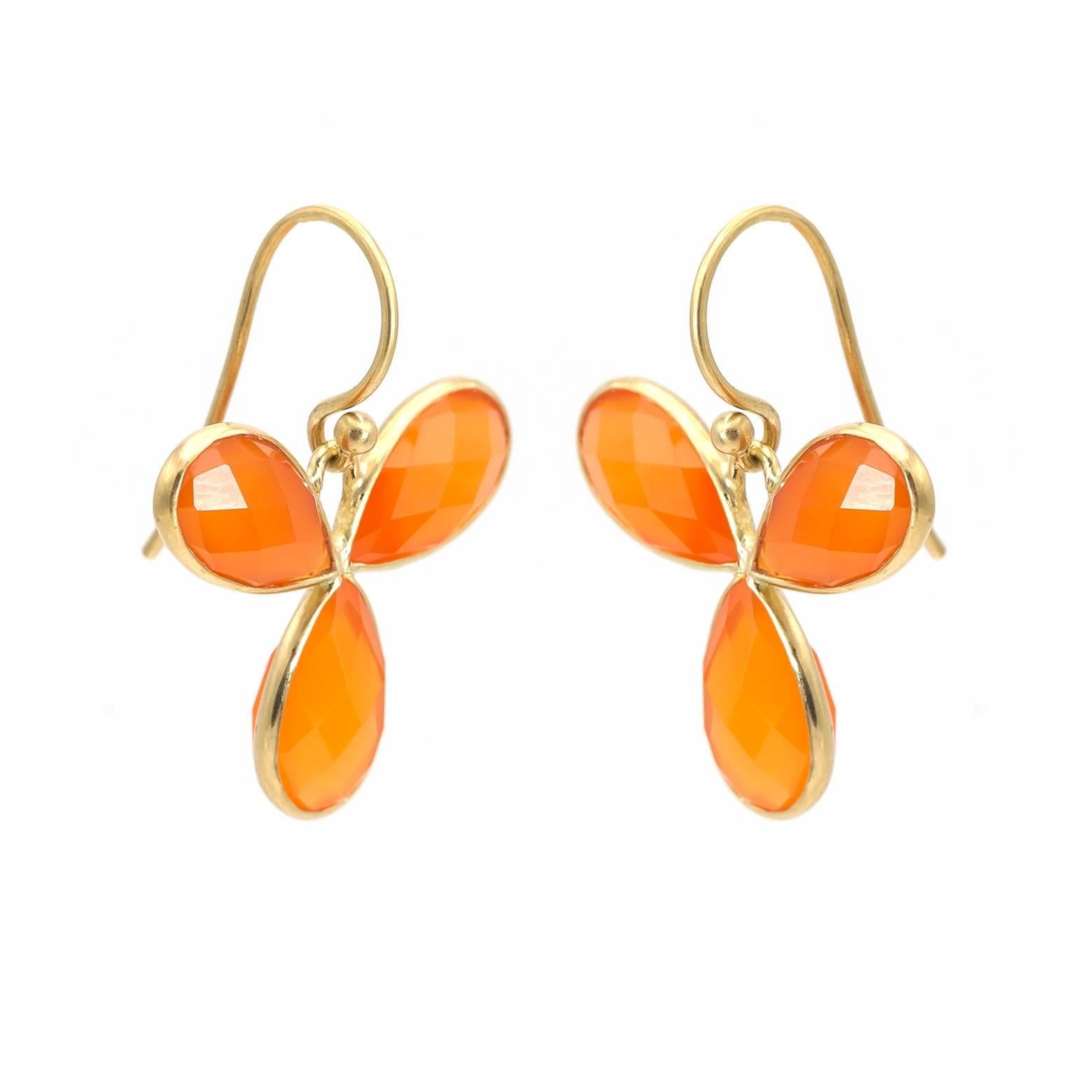 Sunburst petals of bright orange glisten and glow in gorgeous faceted carnelian. Set in 18K yellow gold these regal little beauties are sure brighten up any day and any outfit. Prepare to get extremely happy! 