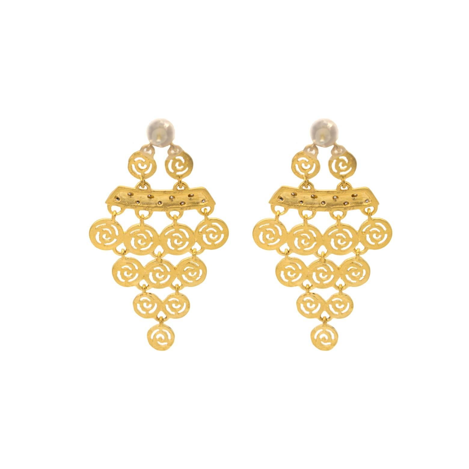 These elegant and glamorous dangle earrings have 18 diamonds total with a satin matte finish on the gold. A beautiful texture as if dipped in gold and accented with 0.13 total weight in diamonds. 