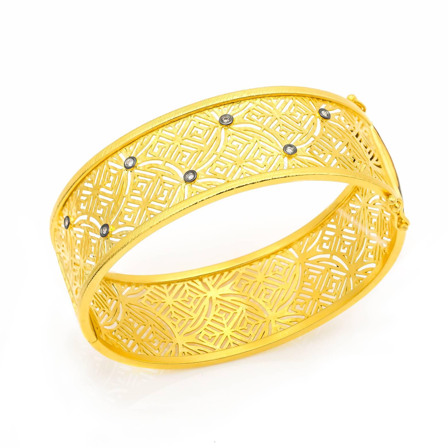 Beautiful and intricate filigree gold vermeil bracelet with oxidized sterling silver and accent diamonds. This bracelet is almost woven-like with its detail- it's gorgeous, comfortable and a must have! 