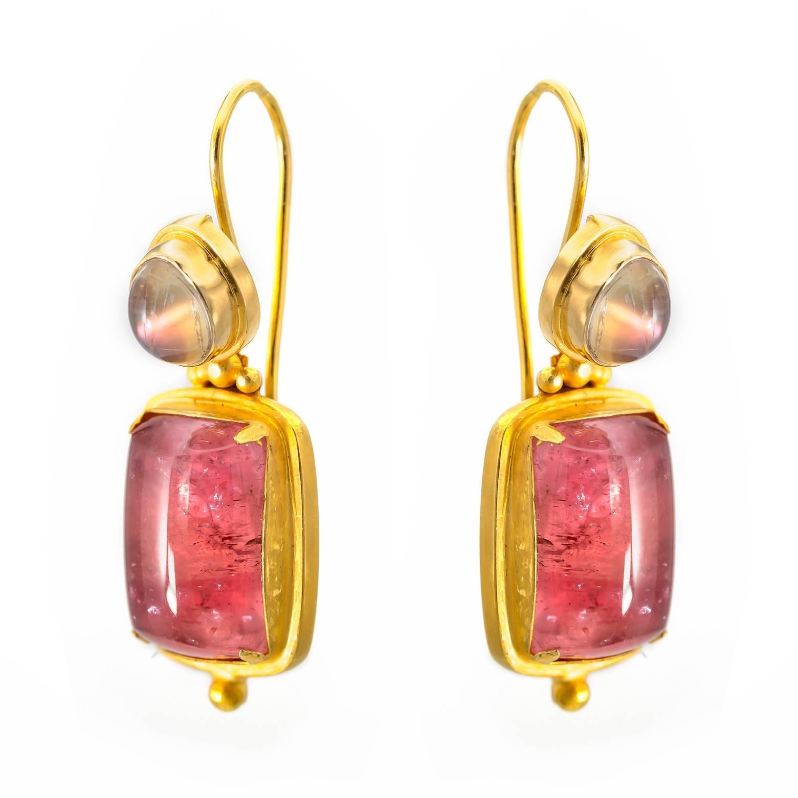Detailed 18K yellow gold with small granulations adorn these bright strawberry tourmaline earrings with tear drop moonstones on top. The tourmaline's swing and sway and dance in their beautiful candy-like color in an artistic fashion!