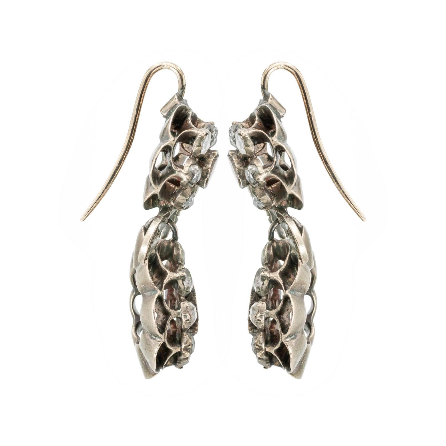 Georgian Pendeloque Old Rose Cut Diamond and Silver Floral Drop Earrings, Boho style.
These antique Pendeloque stunning old rose cut diamond earrings are set in sterling silver from the 1820's. Stylized floral and foliate design, the style is from