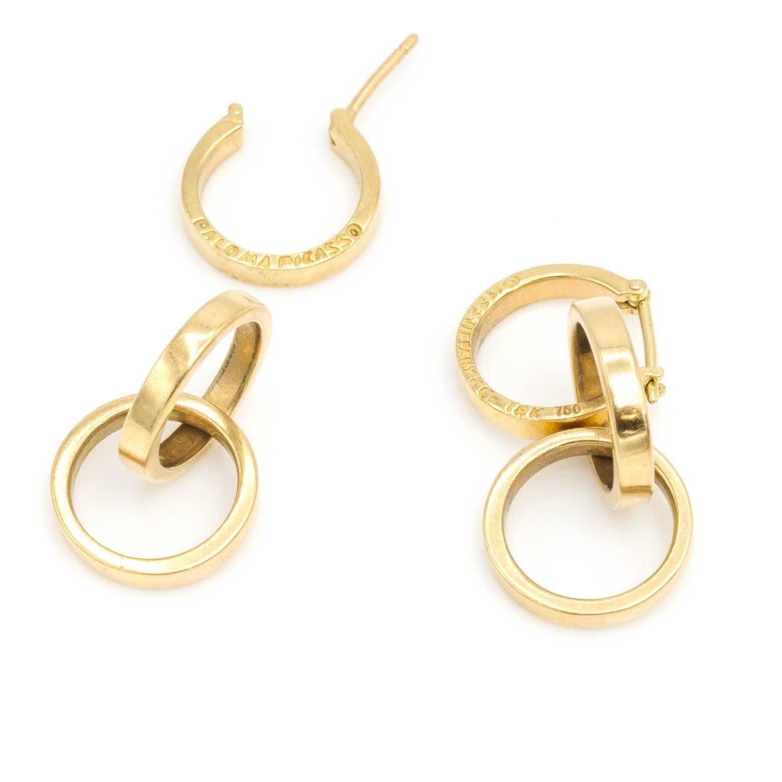 These vintage graphic three connecting hoop Tiffany and Co. Earring are full of style and a collector's item. You can wear them as a single hoop or connect the remaining two to create a three ring masterpiece. 18K yellow gold with the classic stamp