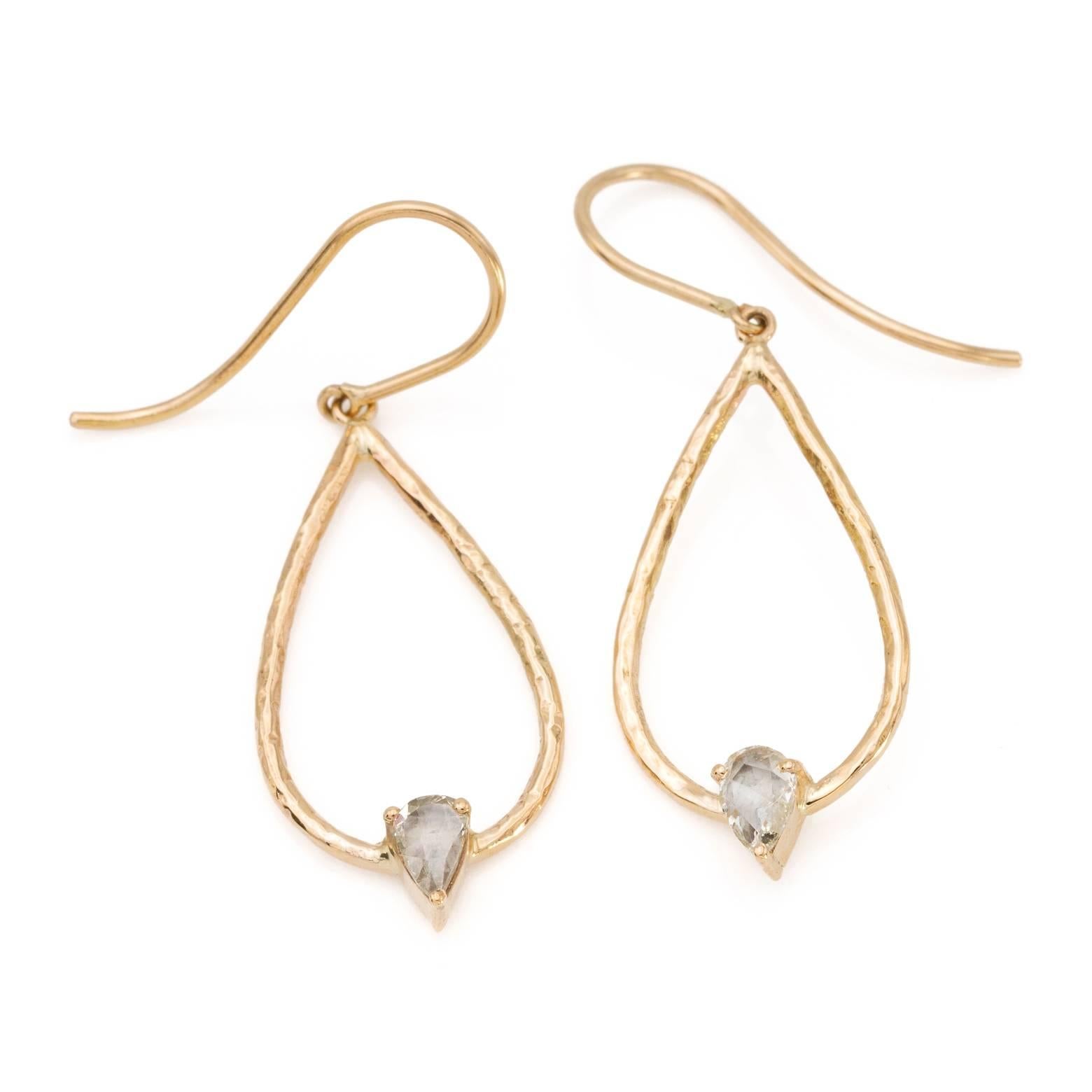 These simple and elegant diamond drop earrings are perfect for everyday or for day to evening. The Rose cut diamonds are suspended on a 'trapeze' style teardrop that has a beautiful texture in 18k gold. 