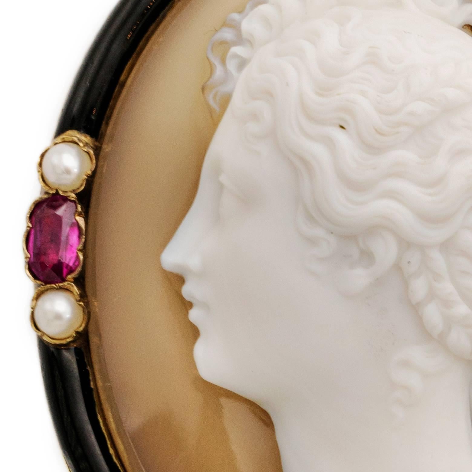 Four dazzling light pink rubies, eight fresh water pearls, hand carved agate with black enamel. Excellent craftsmanship as this is entirely carved of one piece of agate. Intricate detail,  stunning and in excellent shape. This brooch has the