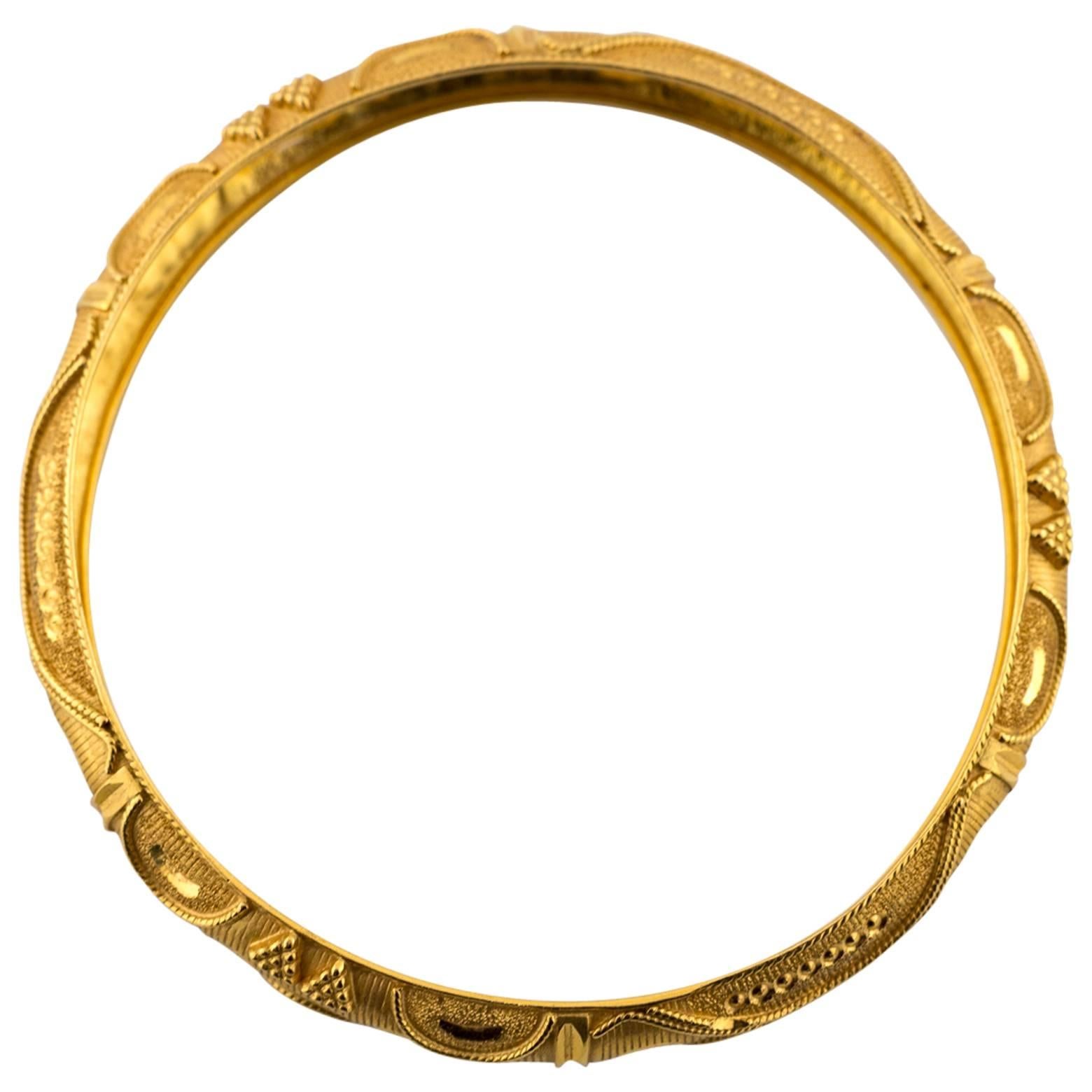 This 22K Yellow Gold Bangle is finely detailed and engraved with such intricacy everyone will want to admire it! You can stack it if you want to glam it up but it is so beautiful that wearing it alone will be exquisite. 