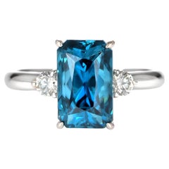 7.05 Carat Natural Blue Zircon and Diamond Three Stone Ring Made in Platinum