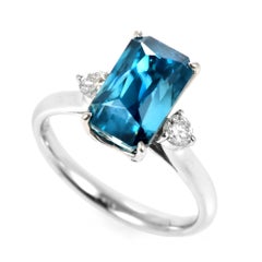 7.05 Carat Natural Blue Zircon and Diamond Three Stone Ring Made in Platinum