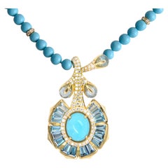 Collana con ciondolo a forma di loto in oro giallo 14 carati con turchese dell’Arizona, topazio blu e diamanti