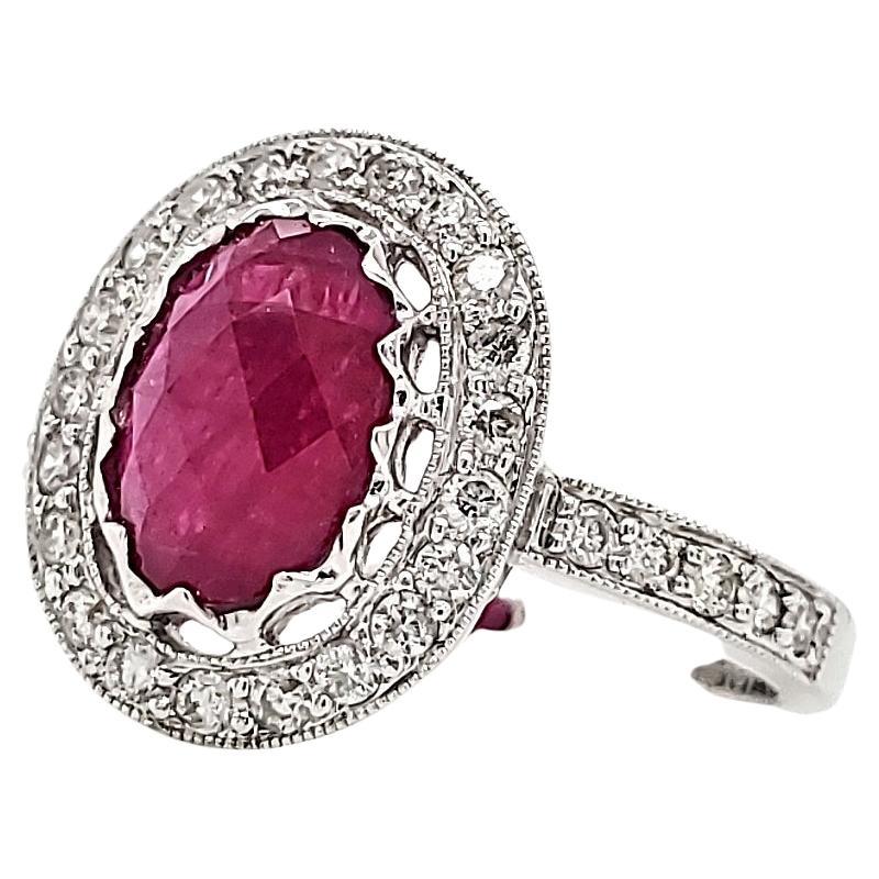 It's a jewel fit for a queen, promising warmth, unwavering devotion, and a love that burns with an unyielding flame.

The center stage features a captivating 1.86-carat Ruby.

Encircling the ruby are 31 meticulously hand-cut diamonds totaling 0.49