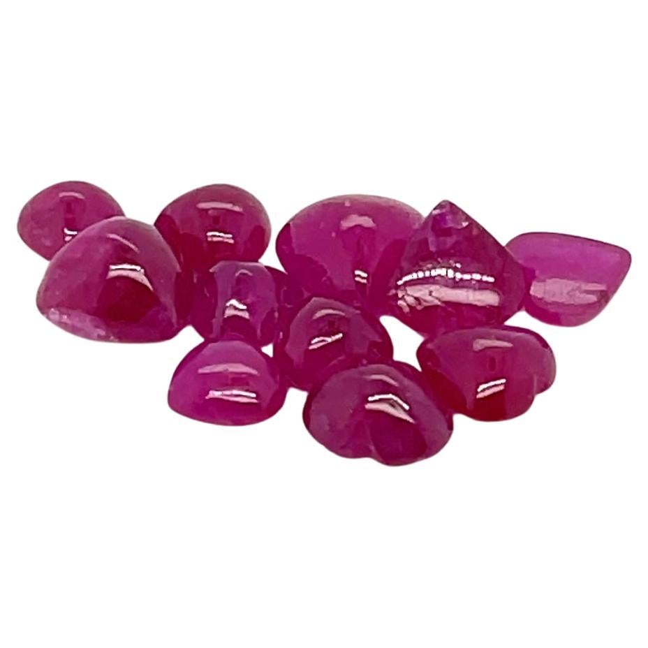 A symbol of love and passion, these 11 ruby heart-shaped cabochons radiate a deep, fiery red hue that captures the essence of romance. 

Sourced from Myanmar, these natural rubies are known for their vibrant color and durability.
Rubies have long