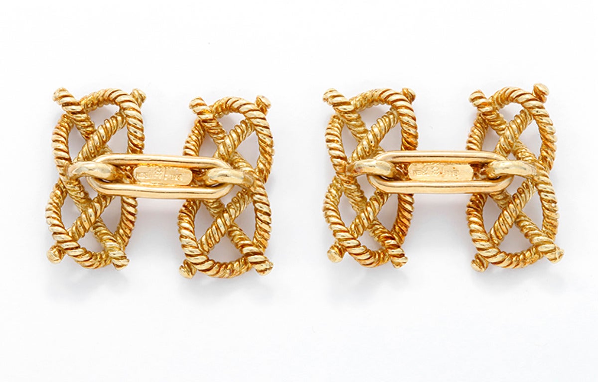These amazing textured 18k yellow gold cufflinks are designed as a knot. Signed Ralph Lauren and Tiffany & Co. The knot links measure apx. 3/4-inch in length.  Total weight is 10.8 grams.