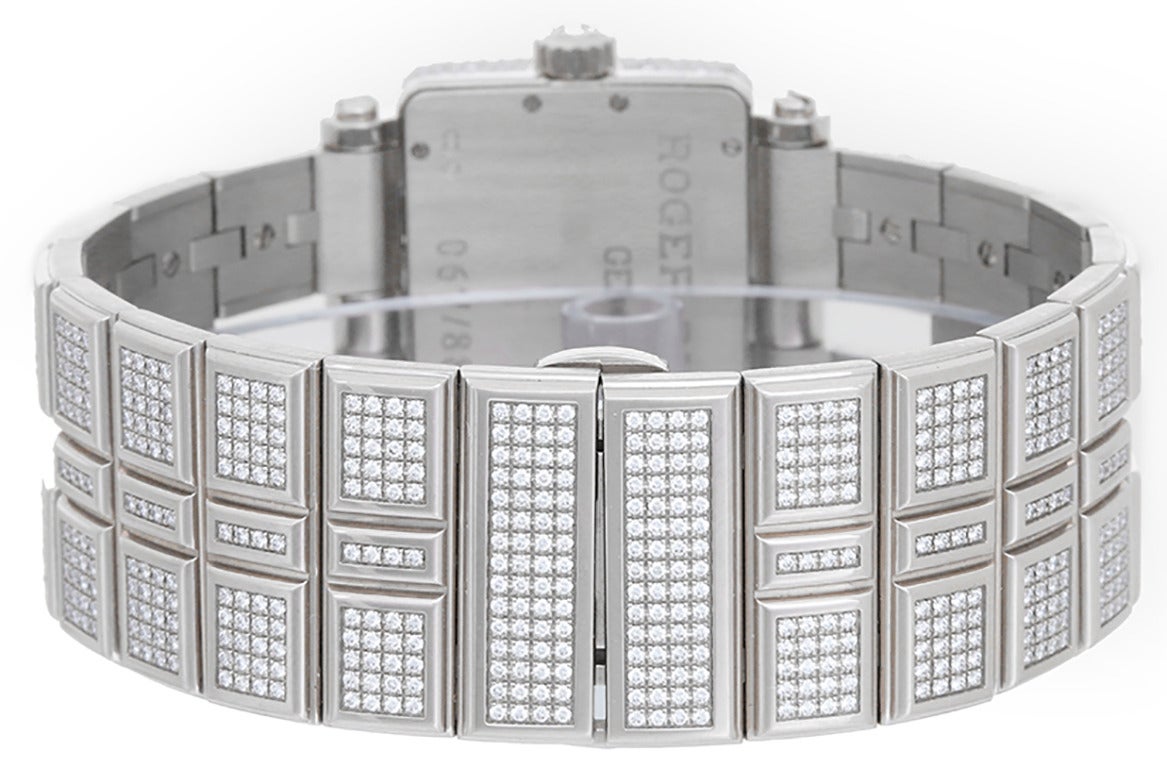 Quartz. 18k white gold pave diamond case and lugs (30mm x 34mm). Mother of pearl dial with 4 blocks of pave diamonds and Arabic 9 & 3 hour markers. 18k white gold bracelet with pave diamond links (will fit apx. 6-1/2-in. wrist). Pre-owned, with