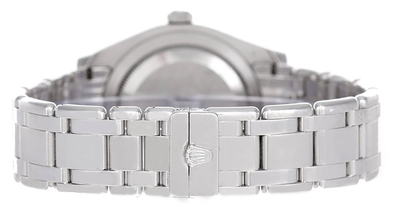Automatic winding. Platinum case with Rolex diamond bezel (39mm diameter). Factory silvered dial with diamond hour markers. Platinum Rolex Masterpiece bracelet. Pre-owned with Rolex box and books.