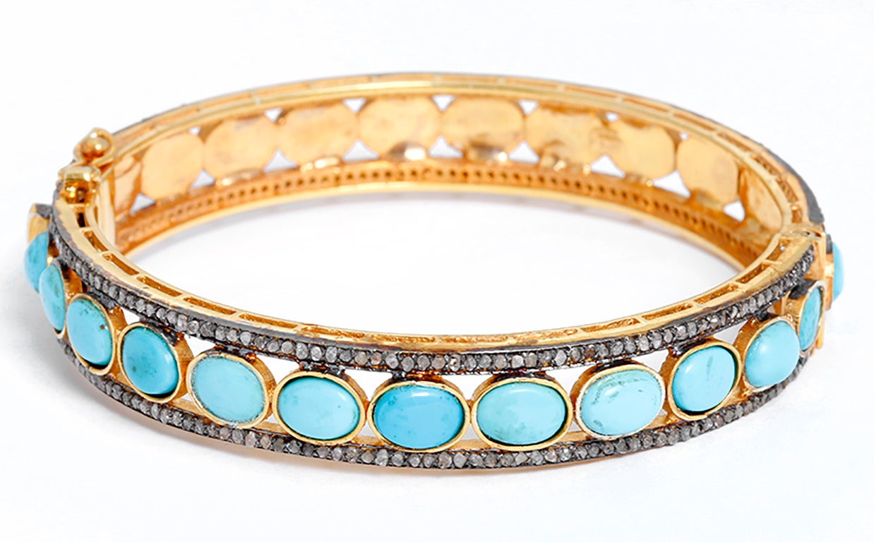 Each bracelet features turquoise centered by a row of 2.4 carats of diamonds on each side set in silver, yellow gold plated. Each bracelet measures apx. 7/16-inch in width and fits apx. a 7-inch wrist. This bracelet set can easily go from day to