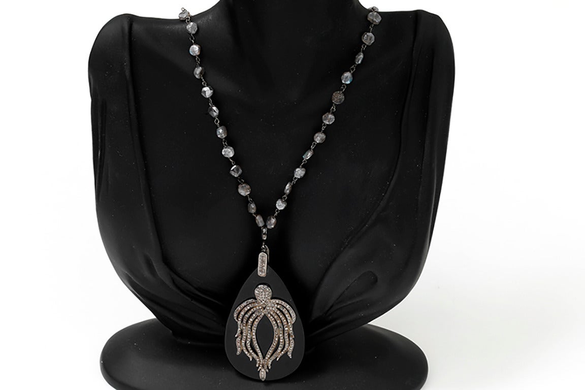 This amazing necklace features a labradorite beaded chain with an onyx pendant featuring 0.72 carats of diamonds, making an octopus design set in oxidized silver. The chain measures apx. 36-inches in length with  apx. 3-inch pendant. Total weight is