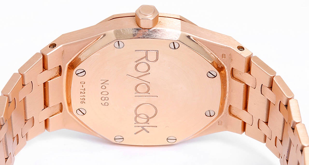 Automatic winding. 18k rose  gold case (36mm diameter). Ivory waffle dial with gold stick markers; date at 3 o'clock position. 18k rose gold Royal Oak bracelet (will fit apx. 7-1/2-inch wrist). Pre-owned with box and papers.