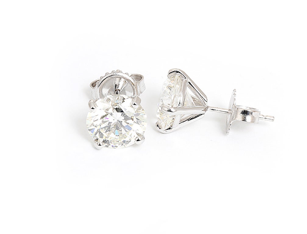 These stunning earrings feature 4.41 ctw. of I-color and SI2-clarity diamonds set in 18k white gold. Total weight is 3.6 grams. These earrings are stunning and are great for any look! See additional images for GIA certificates.