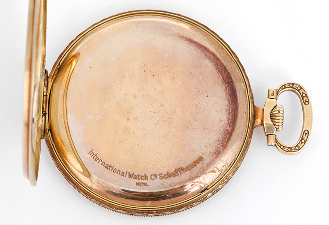 Manual winding. 14k yellow gold case with argyle design on case back and Art-Deco style engraving around edge  (47mm diameter). Champagne colored dial with gold Arabic numerals; subseconds dial. Pre-owned ca. 1920's.