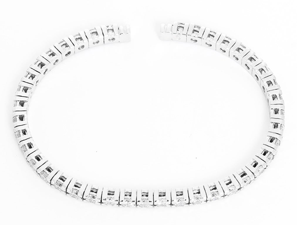 This amazing cuff bracelet features 40 ( apx. 5.35 ctw.) stones that are SI1-SI2 clarity and H-I color set in 14k white gold. The cuff fits apx. a 6-1/2 inch wrist. Total weight is 16.0 grams. This bracelet can be worn alone or stacked with other