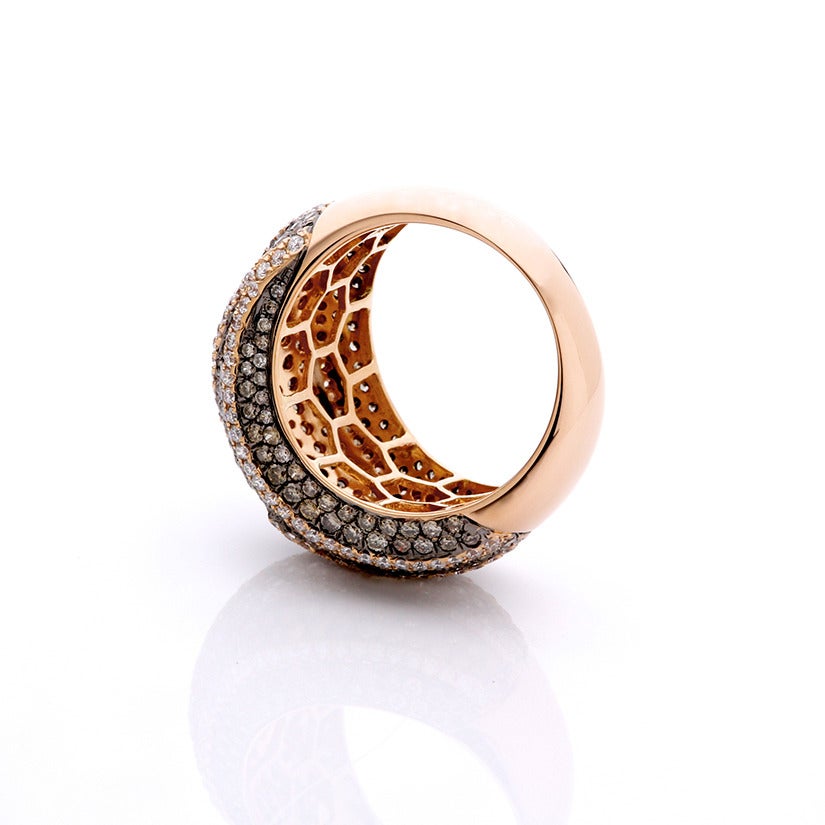 This beautiful ring has 2.69 carats of brown and white diamonds set in 18k rose gold. Total weight is 9.6 grams. Size 7.
