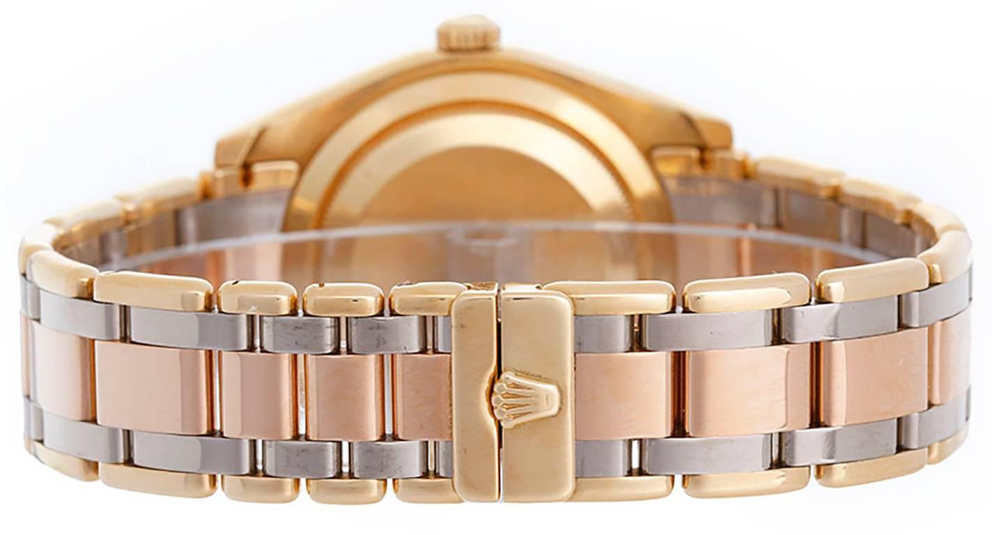  Automatic winding, 31 jewel, sapphire crystal. 18k yellow gold case with factory  40-diamond bezel (39mm diameter). Rolex silver Myriad diamond dial. 18k yellow, white and rose/pink gold Tridor Masterpiece bracelet. Pre-owned with Rolex box and