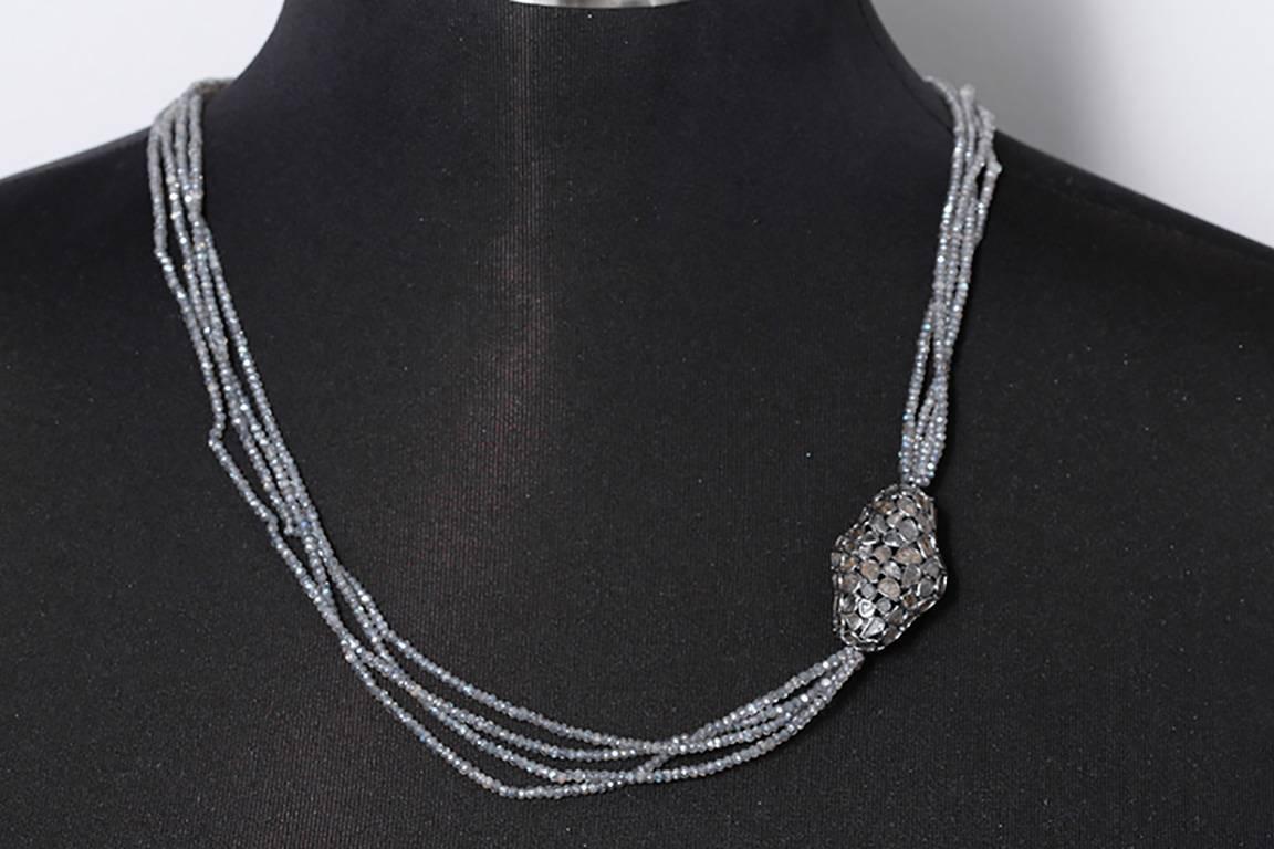 This necklace has a sliced diamond piece, placed asymmetrically for a unique look, with 4 labradorite strands and a diamond clasp set in oxidized sterling silver.  Necklace measures apx. 24-inches in length. Total weight is 23.4 grams.